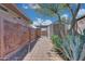 Pathway to shed with metal art and landscaping at 18007 W Ocotillo Ave, Goodyear, AZ 85338