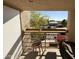 Balcony with small table and chairs, overlooking a parking lot at 1832 N 52Nd St # 205, Phoenix, AZ 85008