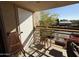 Balcony with small table and chairs, overlooking a parking lot at 1832 N 52Nd St # 205, Phoenix, AZ 85008