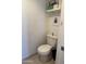 Small bathroom with toilet and shelving at 1832 N 52Nd St # 205, Phoenix, AZ 85008