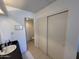 Bathroom with single sink, toilet, and sliding door to closet at 1832 N 52Nd St # 205, Phoenix, AZ 85008