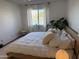 King-size bed in a well-lit bedroom with light decor at 1832 N 52Nd St # 205, Phoenix, AZ 85008