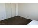 Bedroom with double doors and brown carpet at 1832 N 52Nd St # 205, Phoenix, AZ 85008