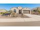 Single story home with attached two-car garage and desert landscaping at 18873 N 262Nd Dr, Buckeye, AZ 85396