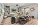 Relaxing living room with gray sectional sofa, built-in shelving, and large TV at 18873 N 262Nd Dr, Buckeye, AZ 85396