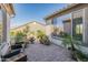 Relaxing backyard patio with seating area and water feature at 18873 N 262Nd Dr, Buckeye, AZ 85396