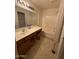 Bathroom with double vanity, bathtub, and a mirror at 19379 N Miller Way, Maricopa, AZ 85139