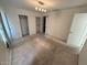 Bedroom with carpet and double closets at 19379 N Miller Way, Maricopa, AZ 85139