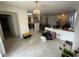 Dining area with tile floors and kitchen access at 19379 N Miller Way, Maricopa, AZ 85139