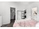 Bedroom with a pink comforter, washer, and dryer at 22125 N 29Th Ave # 127, Phoenix, AZ 85027