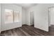 Inviting bedroom featuring stylish vinyl wood floors, a large window, and a neutral color palette at 22125 N 29Th Ave # 127, Phoenix, AZ 85027