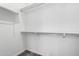 Spacious walk-in closet with white walls and shelving for optimal storage and organization at 22125 N 29Th Ave # 127, Phoenix, AZ 85027