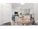 Inviting open-concept dining area with modern decor seamlessly connects living spaces at 22125 N 29Th Ave # 127, Phoenix, AZ 85027