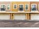 Townhome featuring garages below and balconies; with coordinated color schemes and unified design at 22125 N 29Th Ave # 127, Phoenix, AZ 85027