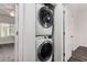 Efficient laundry room showcasing a stacked washer and dryer unit for convenient laundry care at 22125 N 29Th Ave # 127, Phoenix, AZ 85027