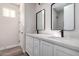 Modern bathroom with dual vanity, quartz countertops, and black faucets at 23437 E Cactus Forest Rd, Florence, AZ 85132