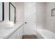 Clean bathroom, featuring a bathtub and modern vanity with quartz countertops at 23437 E Cactus Forest Rd, Florence, AZ 85132