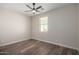 Bedroom with wood-look tile floors and ceiling fan at 23437 E Cactus Forest Rd, Florence, AZ 85132