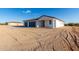 House exterior showcasing a two-car garage and stucco finish at 23437 E Cactus Forest Rd, Florence, AZ 85132