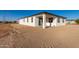 Rear exterior view of house with covered patio and stucco siding at 23437 E Cactus Forest Rd, Florence, AZ 85132