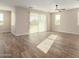 Living room with sliding glass doors, tile floors and ceiling fan at 23437 E Cactus Forest Rd, Florence, AZ 85132