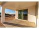 Covered patio with sliding glass doors and concrete flooring at 23437 E Cactus Forest Rd, Florence, AZ 85132