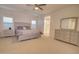 Spacious bedroom with gray furniture and ensuite bathroom access at 2508 N Franz Ln, Casa Grande, AZ 85122