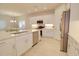 Modern kitchen with white cabinets, island, and stainless steel appliances at 2508 N Franz Ln, Casa Grande, AZ 85122