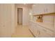 Laundry room with white cabinets and countertop space at 2508 N Franz Ln, Casa Grande, AZ 85122