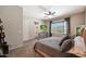 Comfortable bedroom with patio access and TV at 28957 N 70Th Dr, Peoria, AZ 85383