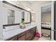 Double vanity bathroom with marble countertop and large mirror at 2915 E Constance Way, Phoenix, AZ 85042