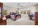 Bright bedroom with a wooden bed frame and ensuite bathroom at 2915 E Constance Way, Phoenix, AZ 85042