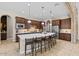 Gourmet kitchen features a large island with seating for six at 2915 E Constance Way, Phoenix, AZ 85042