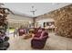 Living room features a stone accent wall, open floor plan, and access to backyard at 2915 E Constance Way, Phoenix, AZ 85042