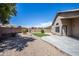 Spacious backyard with gravel, grass, and a patio at 3127 W Folgers Rd, Phoenix, AZ 85027