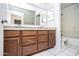 Double vanity bathroom with granite countertops and a bathtub at 3127 W Folgers Rd, Phoenix, AZ 85027