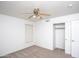 Bedroom featuring neutral decor, a ceiling fan, and a large closet at 3127 W Folgers Rd, Phoenix, AZ 85027