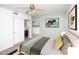 Serene bedroom with a stylish accent wall, natural light, and a spacious closet at 3127 W Folgers Rd, Phoenix, AZ 85027