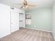 Bright bedroom with neutral walls, ceiling fan, and spacious closet at 3127 W Folgers Rd, Phoenix, AZ 85027