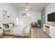 Inviting bedroom with vaulted ceilings, ceiling fan, sitting area, and neutral tones, offering a relaxing retreat at 3127 W Folgers Rd, Phoenix, AZ 85027