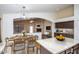 Open concept kitchen flowing into the living room and dining area, perfect for entertaining at 3127 W Folgers Rd, Phoenix, AZ 85027