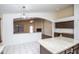 Kitchen features a breakfast bar overlooking the living room and fireplace at 3127 W Folgers Rd, Phoenix, AZ 85027