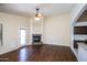 Living room boasts hardwood floors, a fireplace, and an open floor plan at 3127 W Folgers Rd, Phoenix, AZ 85027