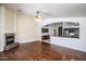 Open concept living room with hardwood floors and a view of the kitchen at 3127 W Folgers Rd, Phoenix, AZ 85027