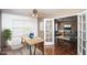 Bright home office with a ceiling fan, sleek desk, modern decor, and French doors at 3127 W Folgers Rd, Phoenix, AZ 85027