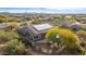 Single story house with solar panels, pool and a desert landscape background at 32032 N 52Nd Way, Cave Creek, AZ 85331