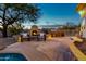 Outdoor patio with fireplace, seating area, and built-in grill at 32032 N 52Nd Way, Cave Creek, AZ 85331