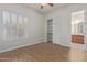 Bright bedroom with wood-look floors, plantation shutters and en-suite bathroom at 32032 N 52Nd Way, Cave Creek, AZ 85331