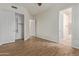 Bedroom with wood-look floors and adjacent bathroom access at 32032 N 52Nd Way, Cave Creek, AZ 85331