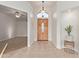 Bright and airy entryway with tiled floors and wood door at 32032 N 52Nd Way, Cave Creek, AZ 85331